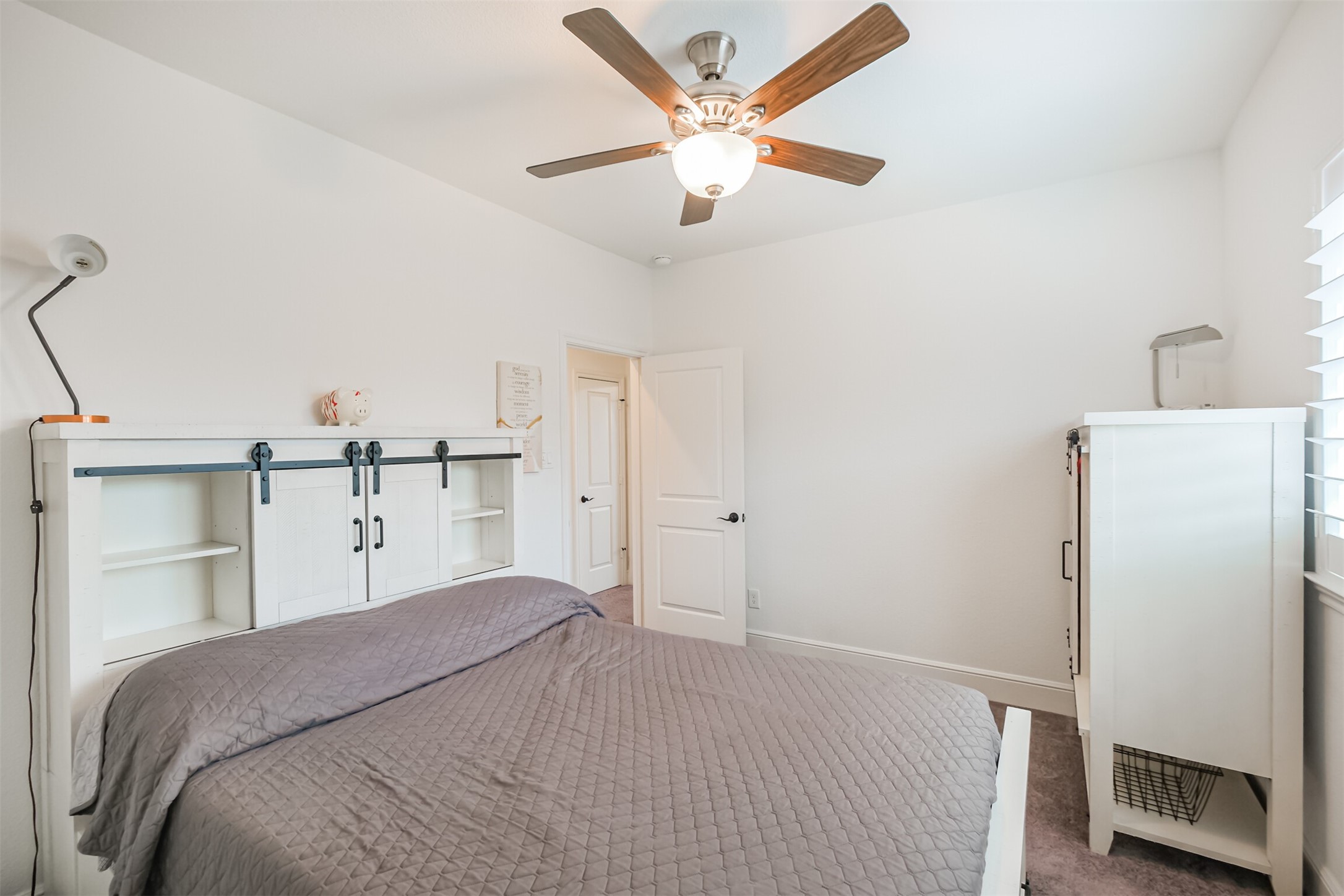 Bright and spacious seventh bedroom offering generous proportions, abundant natural light, and a private en-suite bathroom, creating a comfortable and secluded retreat for family or guests.
