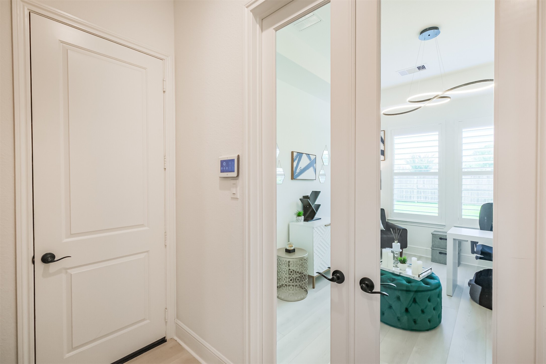 Private first-floor guest suite/third bedroom offering exceptional comfort and privacy, complete with its own bedroom, full bathroom, and dedicated living areaan ideal retreat for guests, extended family, or multigenerational living.