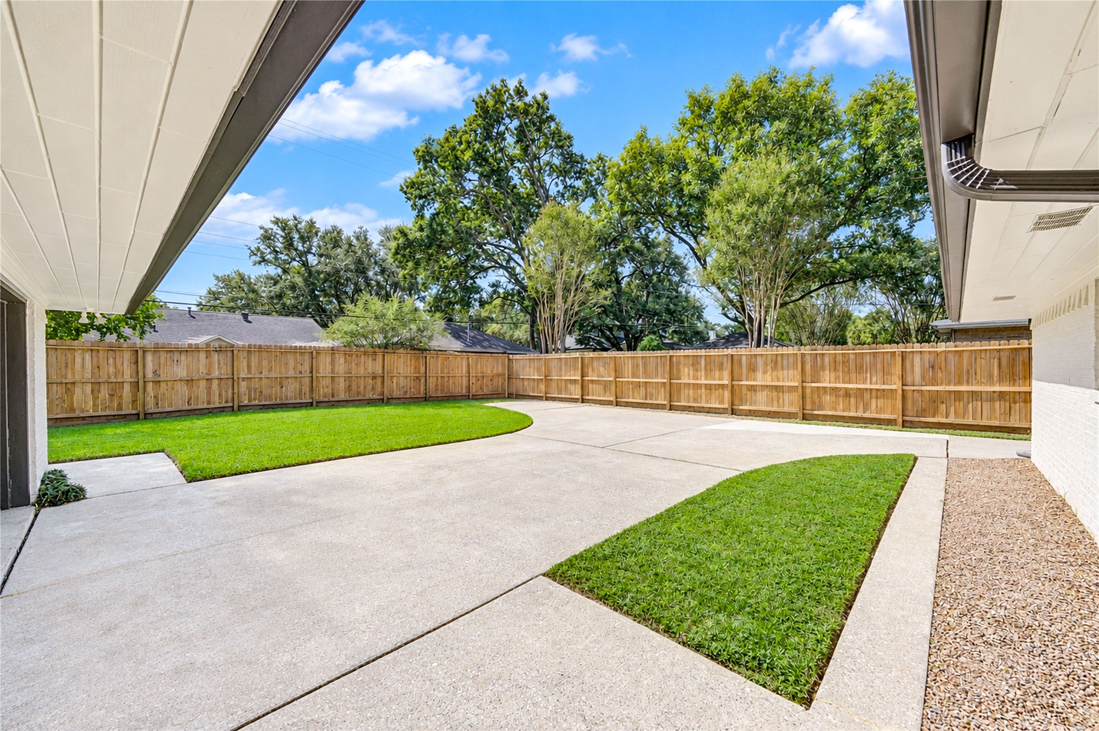 Enjoy the spacious backyard with an expansive concrete patio, privacy fencing, and plenty of room for outdoor gatherings, grilling, and entertaining.