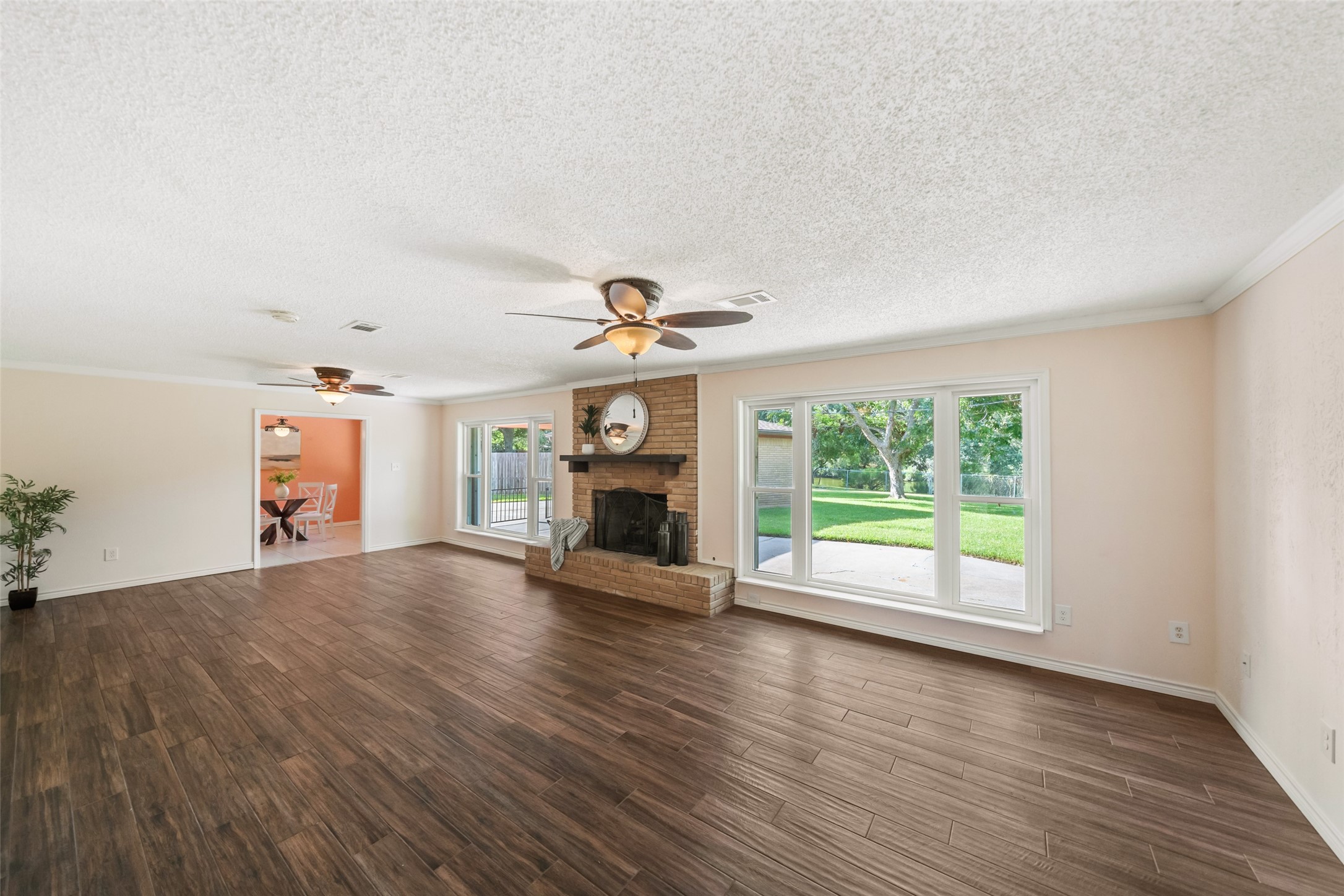 Another great view of the living room. LOVE this wood-look tile in that begins in the entryway and extends seamlessly into the living room.  Look at that VIEW!