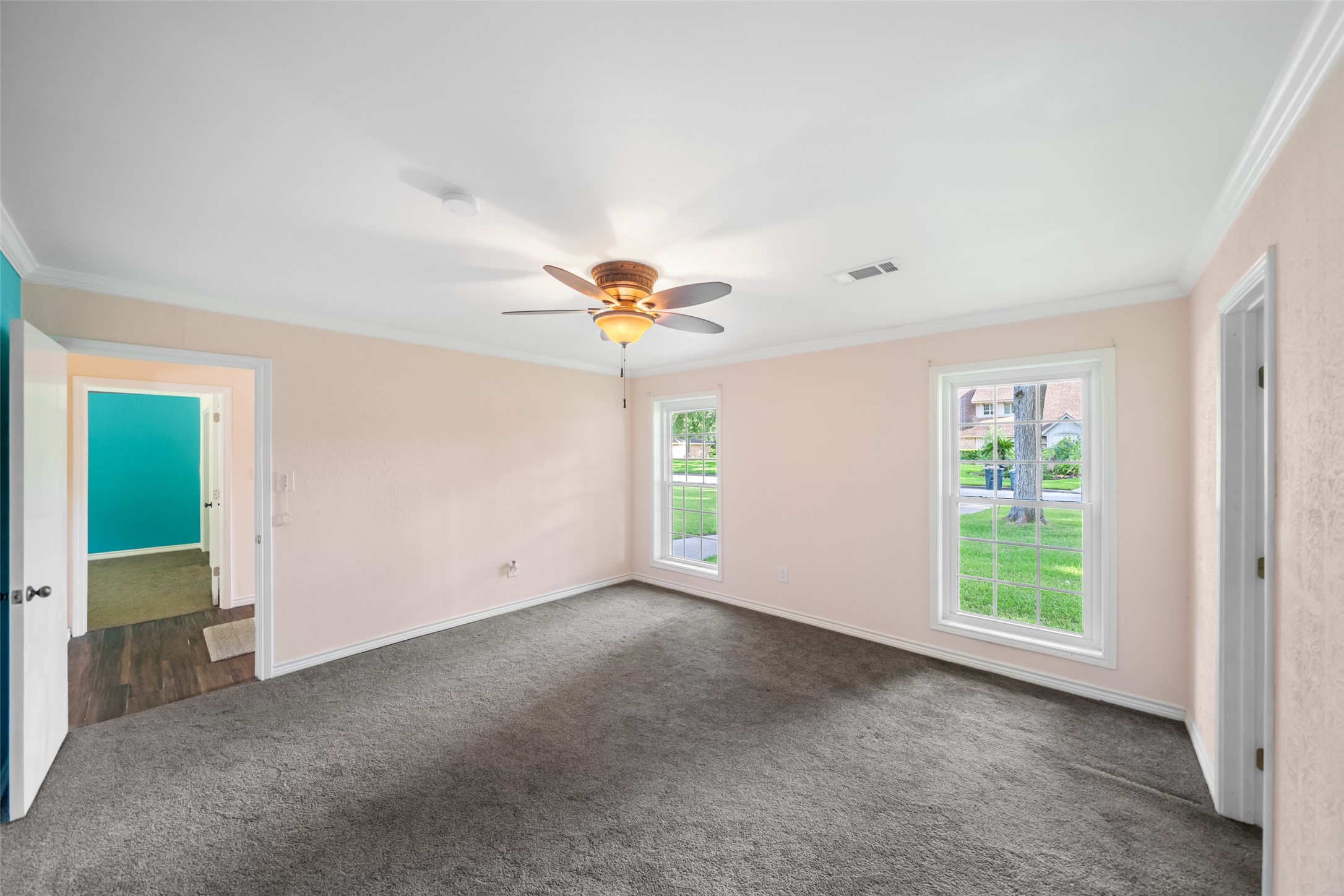 Another view of this spacious bedroom.  Love the size of these windows that look out over the quiet street ahead.