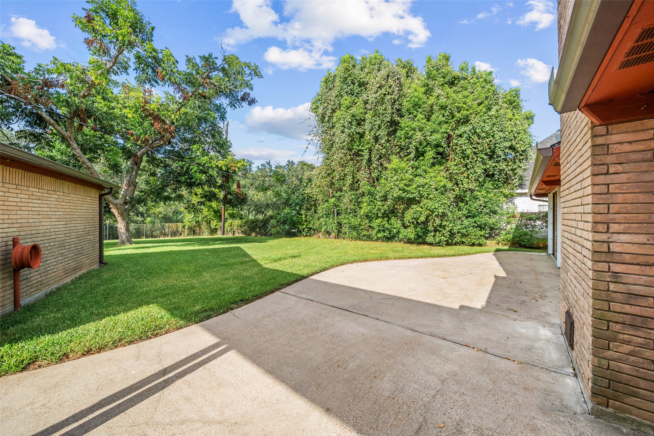 Look at the size of this patio!  Plenty of room for your outdoor patio table, porch swing, and barbecue. Patio is just off of the kitchen, so you can easily entertain friends and family for your backyard get togethers.