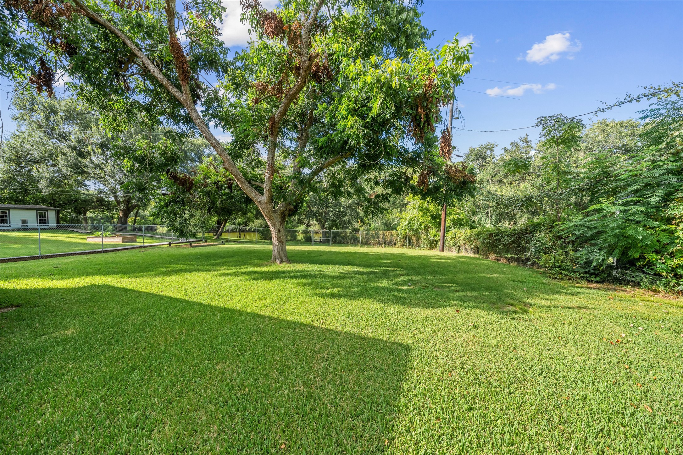 Large, private, pet friendly yard with lot with lots of potential!  Plenty of room for family, kids, and pets to play!!