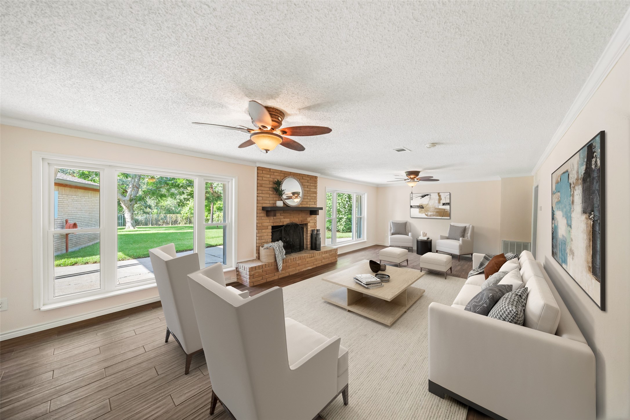 This living room is the perfect combination of indoor and outdoor living!! Spacious cozy interior, with plenty of room for entertaining and an incredible view of the yard and water!!  Virtually staged.