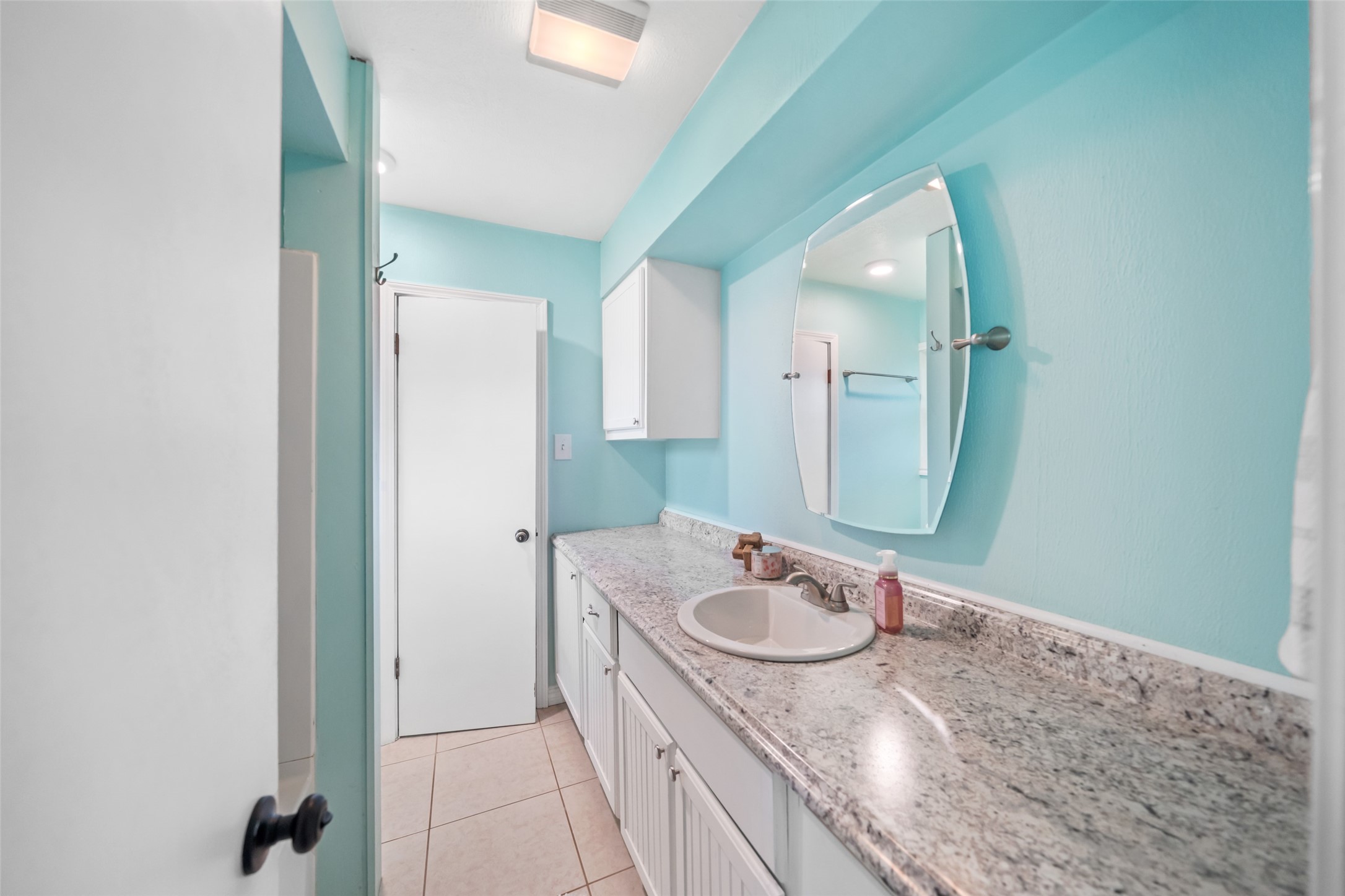 Extra length countertop and cabinet in this full four-piece bathroom!!  You will have plenty of space to store everything you need!