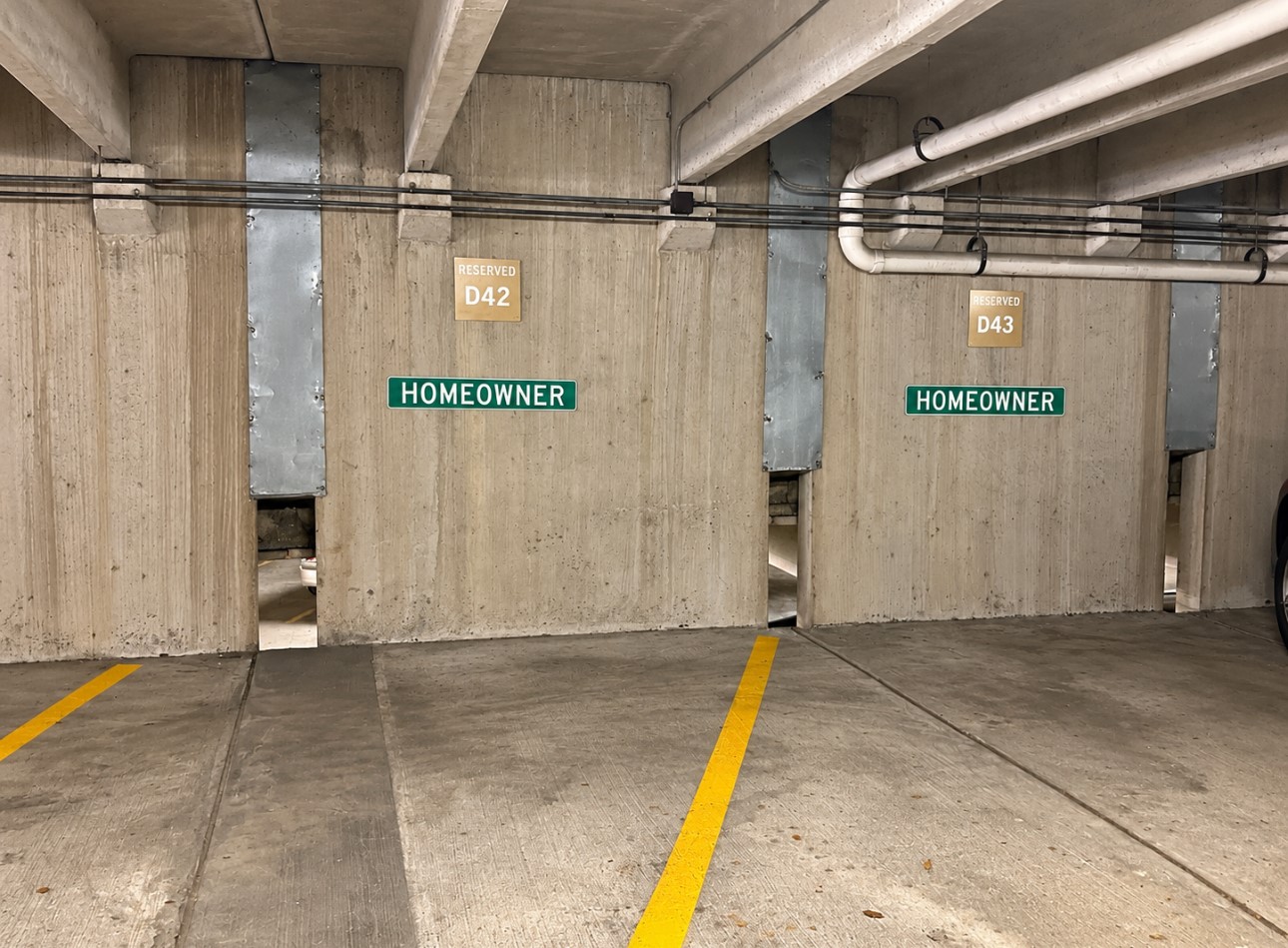 2 allocated parking spaces in parking garage