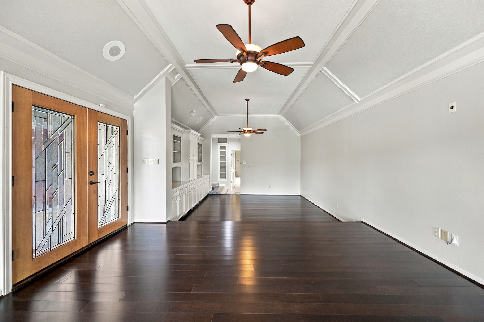 With its generous 15' x 30' dimensions, the Primary Bedroom easily accommodates a king-size bed, bedside tables, and a separate sitting area, offering plenty of room to create your own private retreat while enjoying the beautiful views of Pecan Lake. Double wood/glass doors provide direct access to the Backyard, pool, and spa area, creating a wonderful connection to the home's outdoor living spaces.