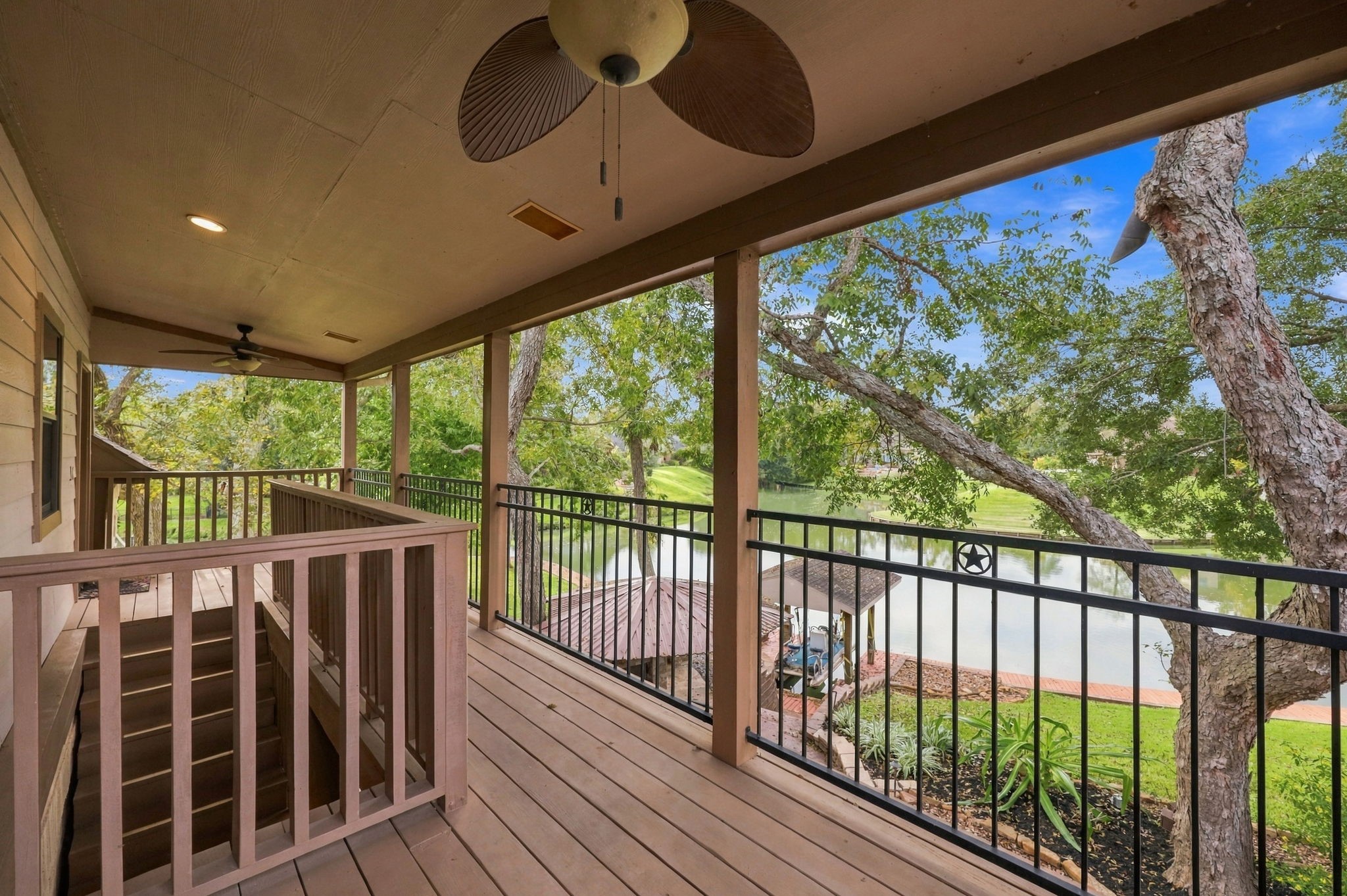 As we make our way to the Garage Apartment, also ideal as a private Guest Suite, you'll find a lovely balcony overlooking the water. It's the perfect spot to enjoy your morning coffee, unwind in the evening, and take in the beautiful waterfront views.