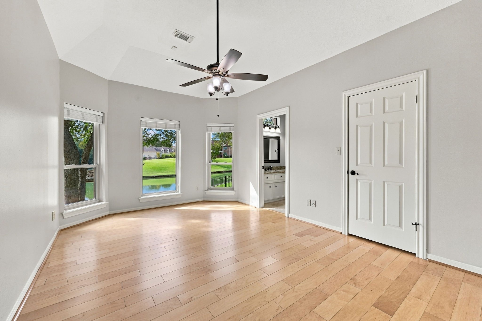 All Secondary Bedrooms are generously sized and feature light wood flooring, walk-in closets with built-ins, and convenient access to a Jack-and-Jill Bathroom. This Bedroom is located at the back of the home and enjoys gorgeous waterfront views, creating a peaceful and picturesque setting.