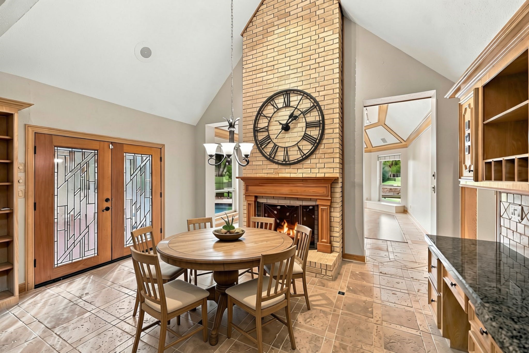 Just off the Breakfast Area, double doors provide convenient access to the back Patio, creating an easy transition between indoor and outdoor living and making it perfect for enjoying morning coffee or entertaining guests. (VIRTUALLY STAGED)