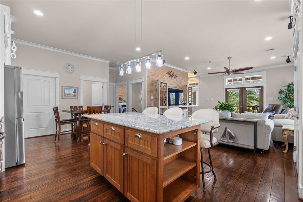 Beautifully appointed open concept kitchen with generous prep space, island seating and abundant storage.