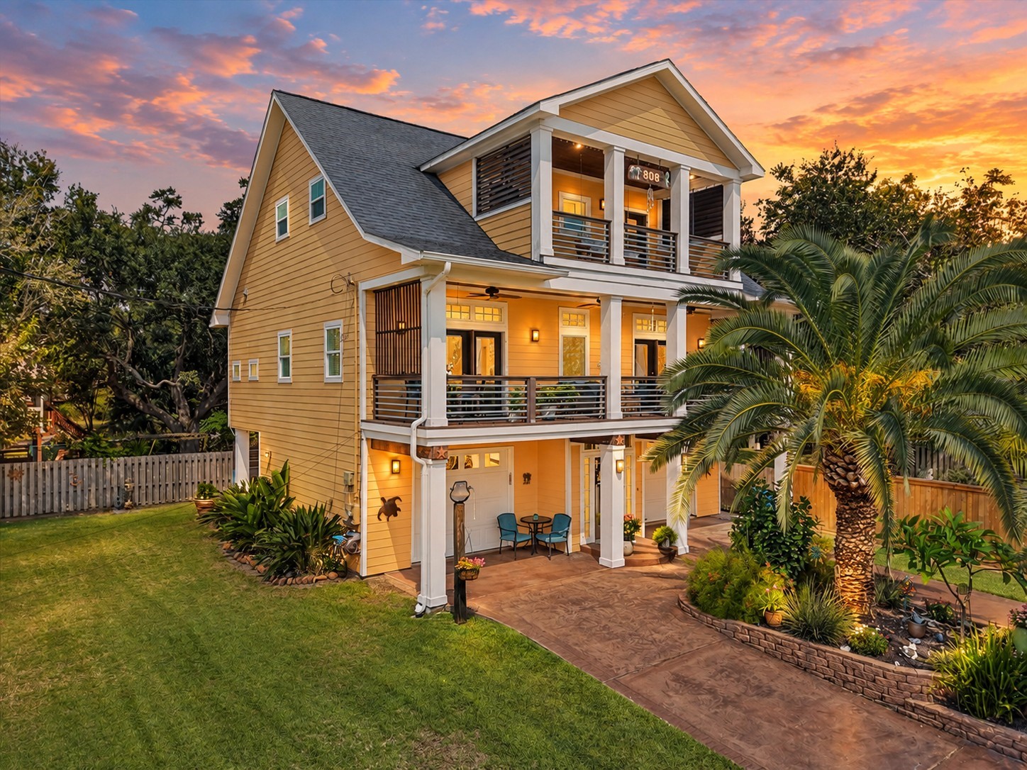 Impressive coastal home with tropical curb appeal and spacious covered balconies. Impressive coastal home with tropical curb appeal and spacious covered balconies.