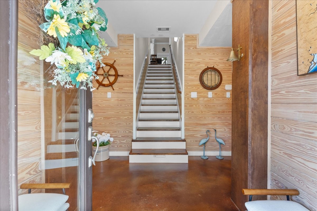 Stunning entryway with enclosed stairs