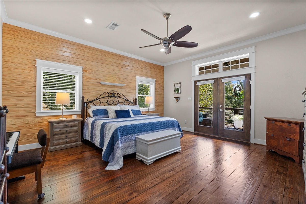 Spacious primary retreat with abundant natural light and a relaxing feel with access to the covered balcony