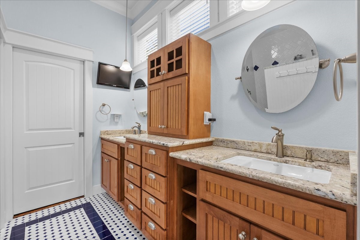 Private en-suite bath complements the spacious primary retreat with walk-in shower and walk-in closet