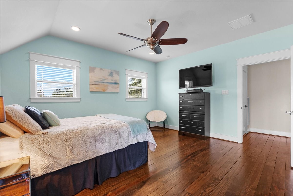 Third bedroom features vaulted ceilings, generous closet space and access to the covered balcony.