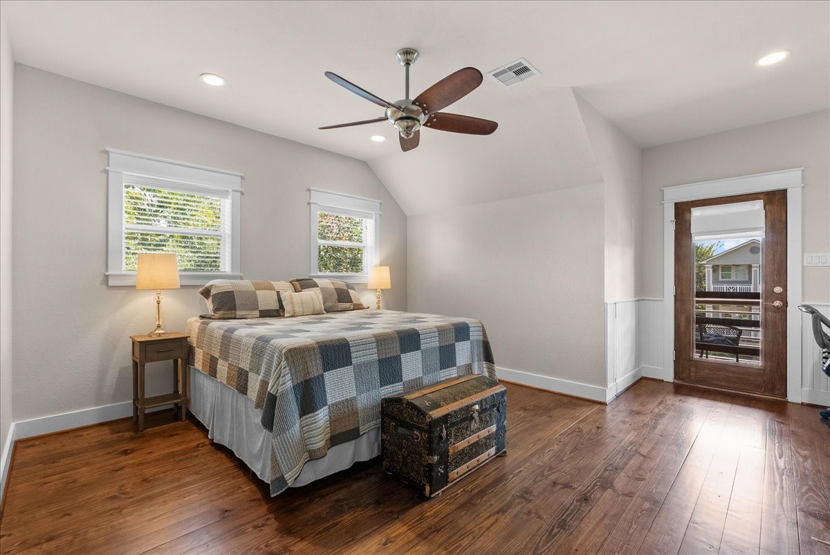 Inviting upstairs bedroom with direct access to the covered balcony, so much natural light.