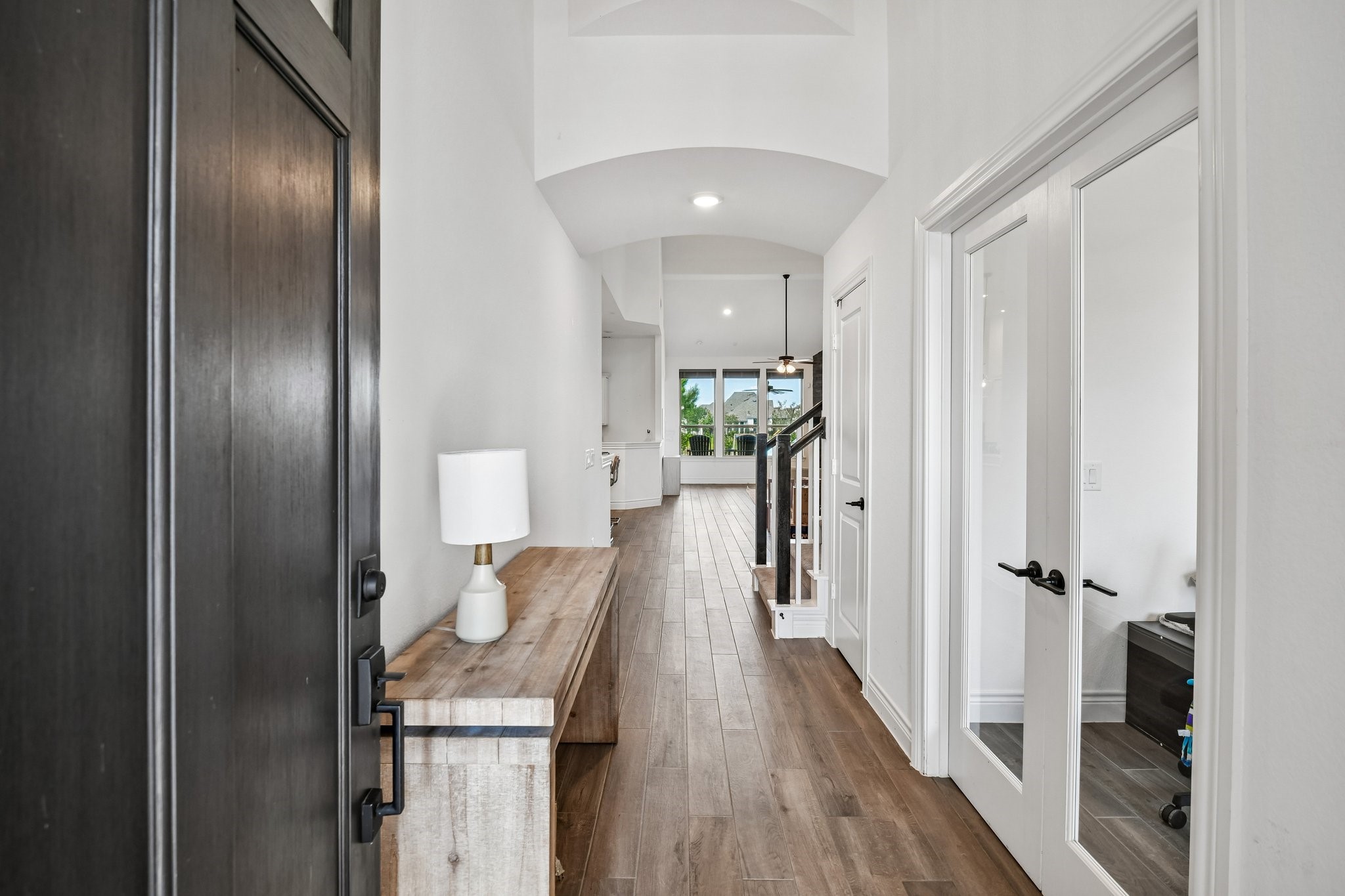 Extended entry hall with wood-look vinyl plank flooring and a direct sightline into the main living areas