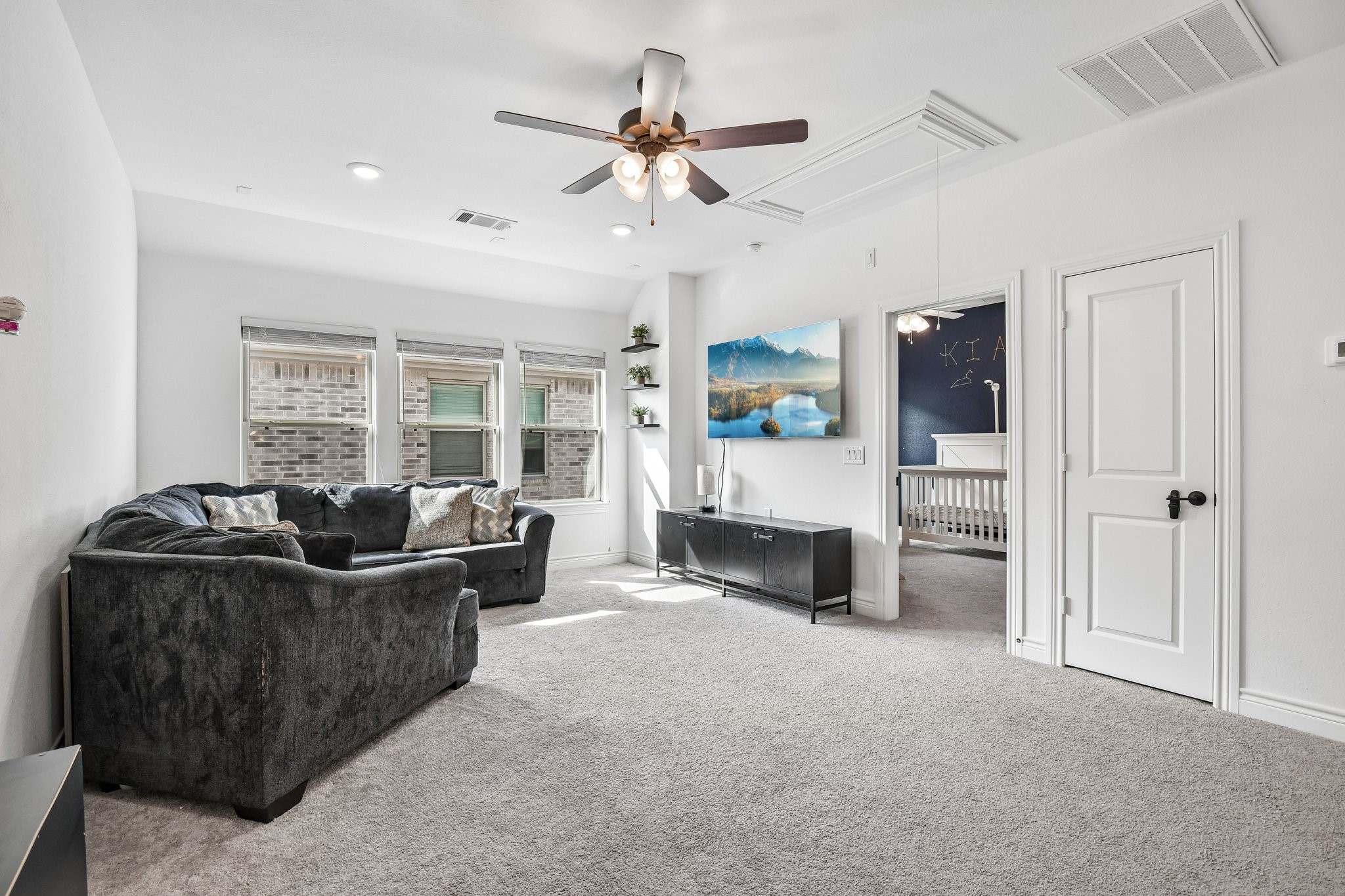 Second game room angle showing the room's size and flexible furniture layout