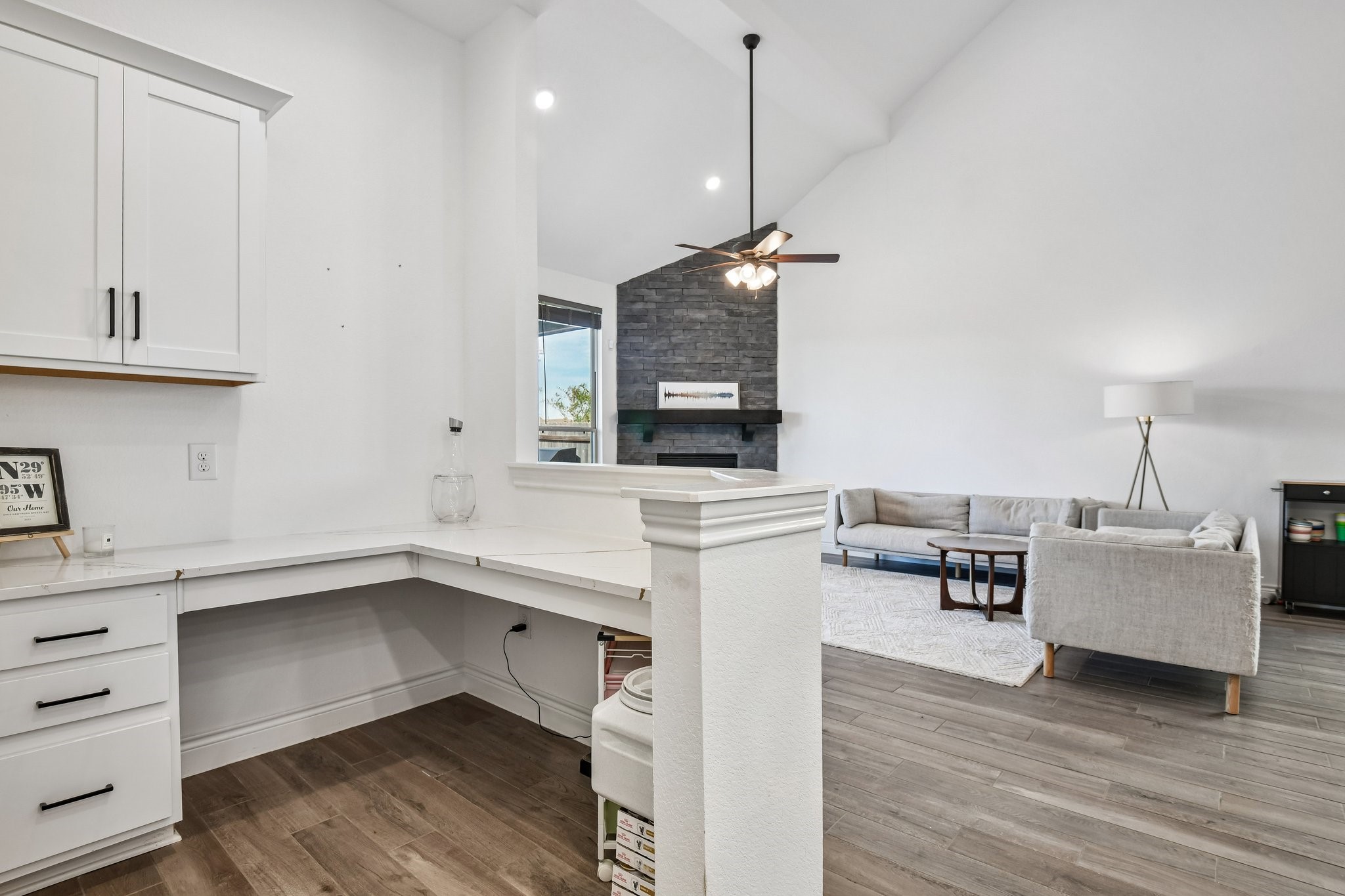 Wet bar and extended prep counter add cabinetry, serving space, and storage just off the kitchen