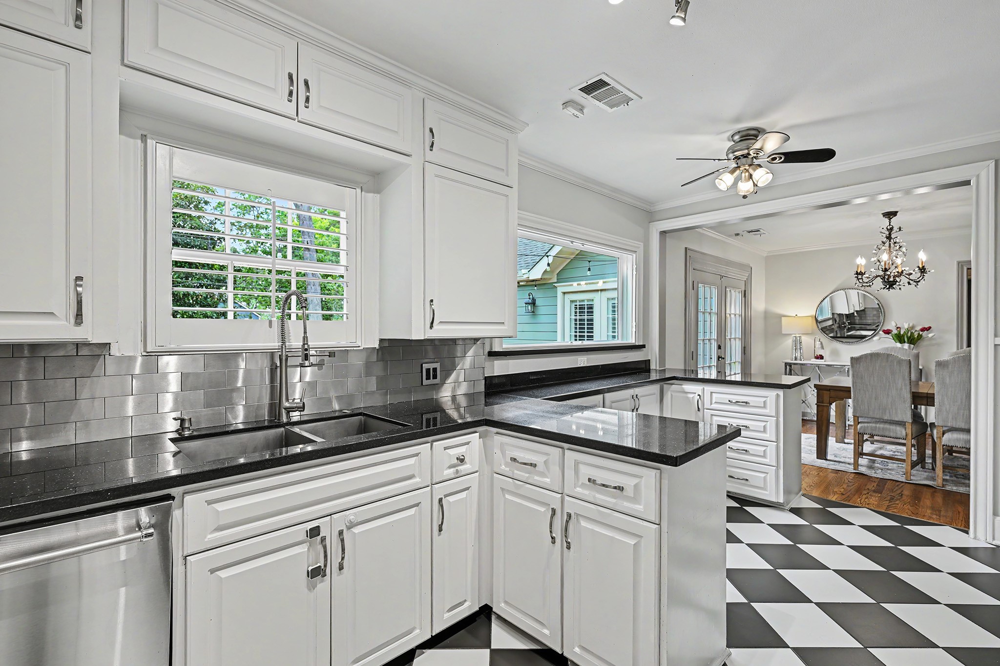 The kitchen combines stylish finishes and timeless character with abundant cabinet storage.