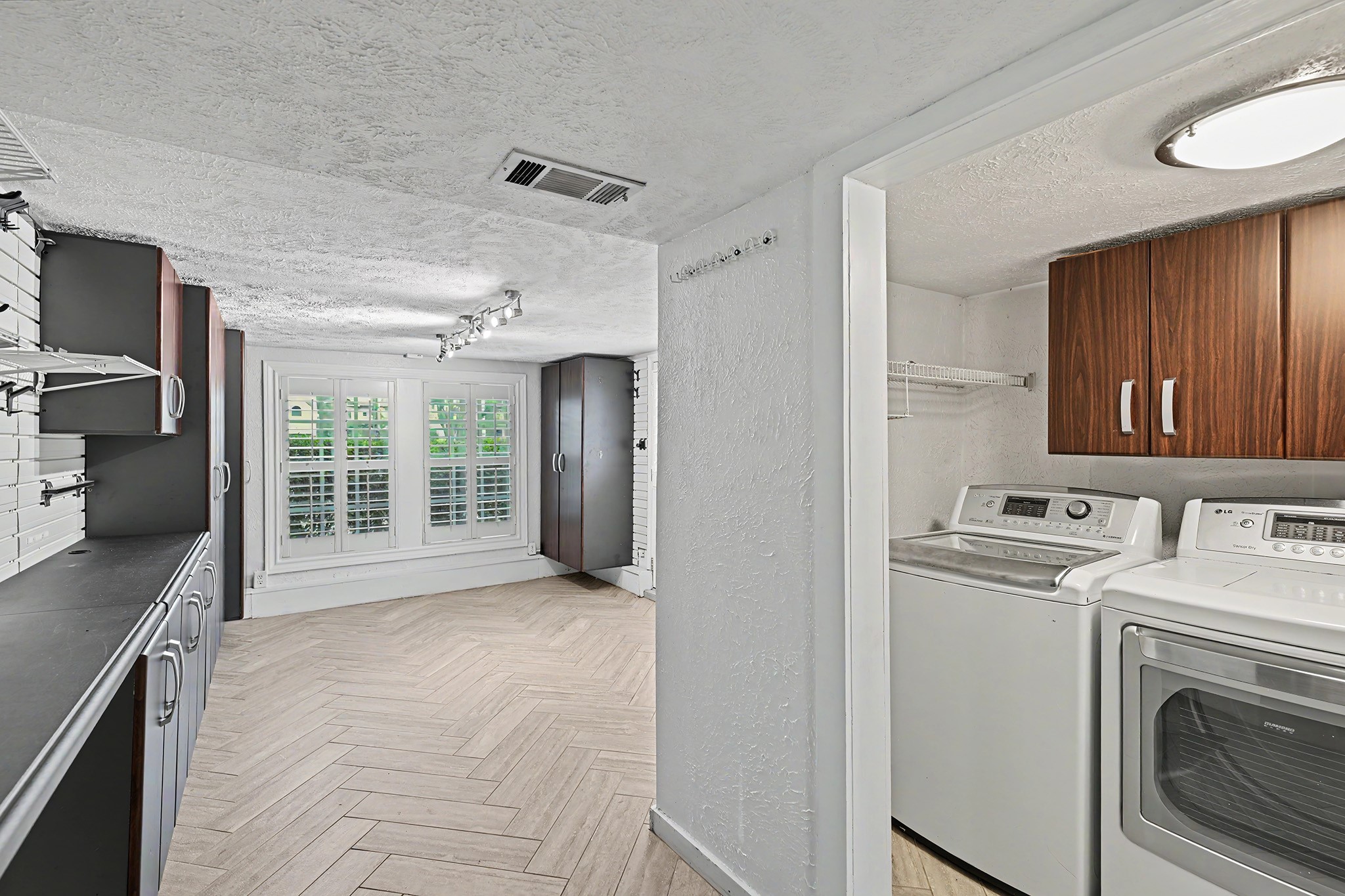 The utility area is conveniently incorporated into the bonus room, adding functionality to this flexible space.