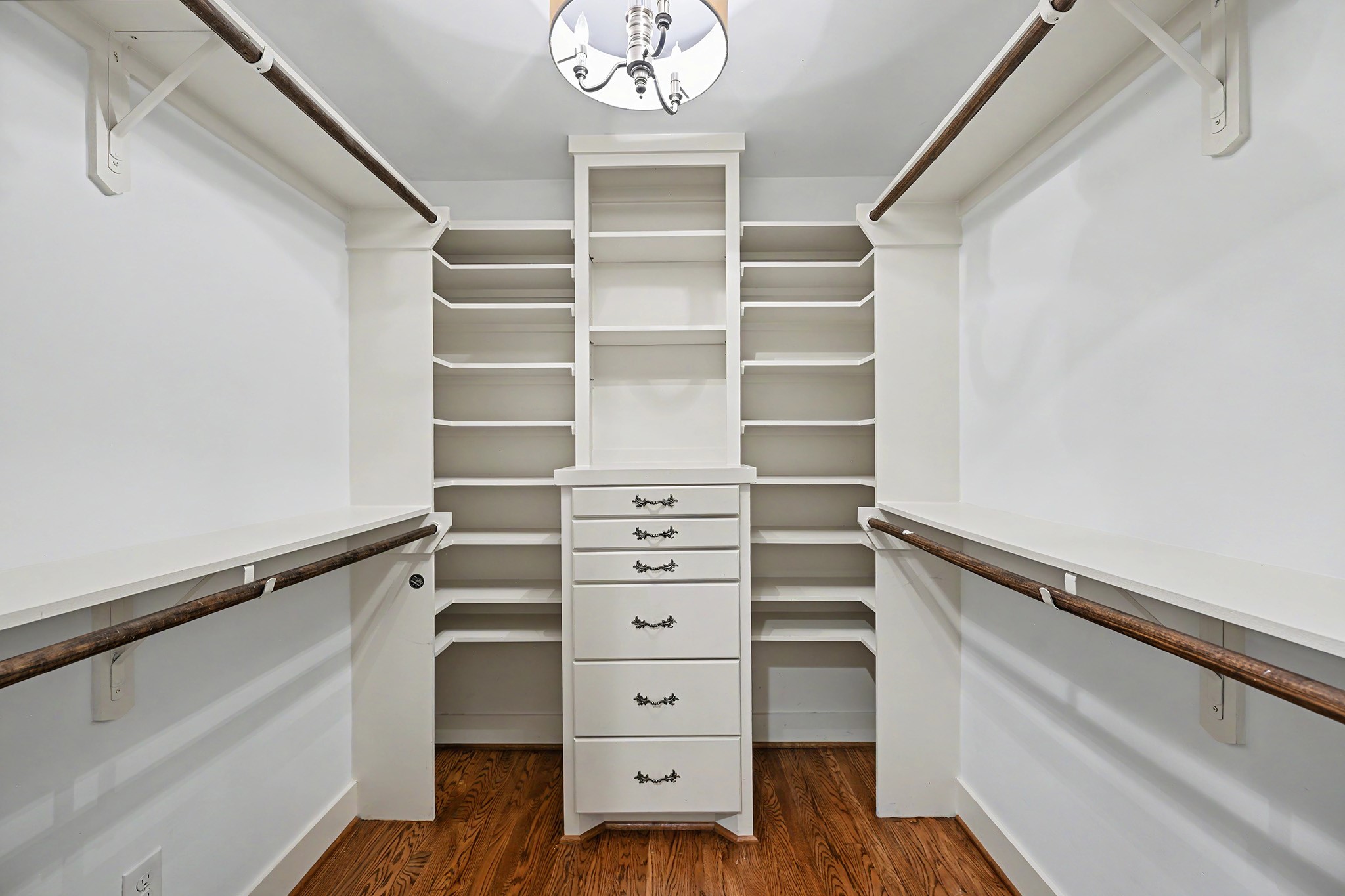 Primary suite includes 3 walk-in closets with built-in storage and ample room for clothing, shoes and accessories.