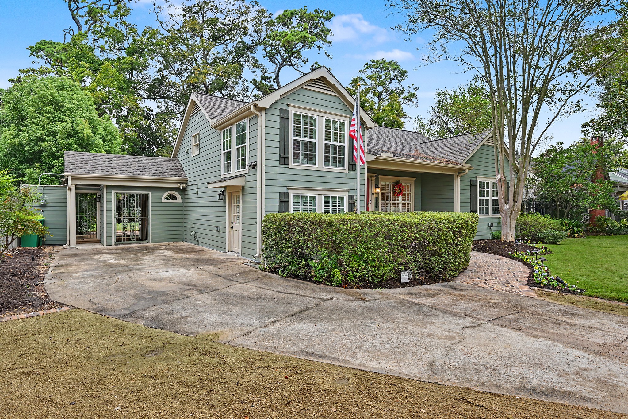 Ample parking is available with a long driveway and an additional parking area.