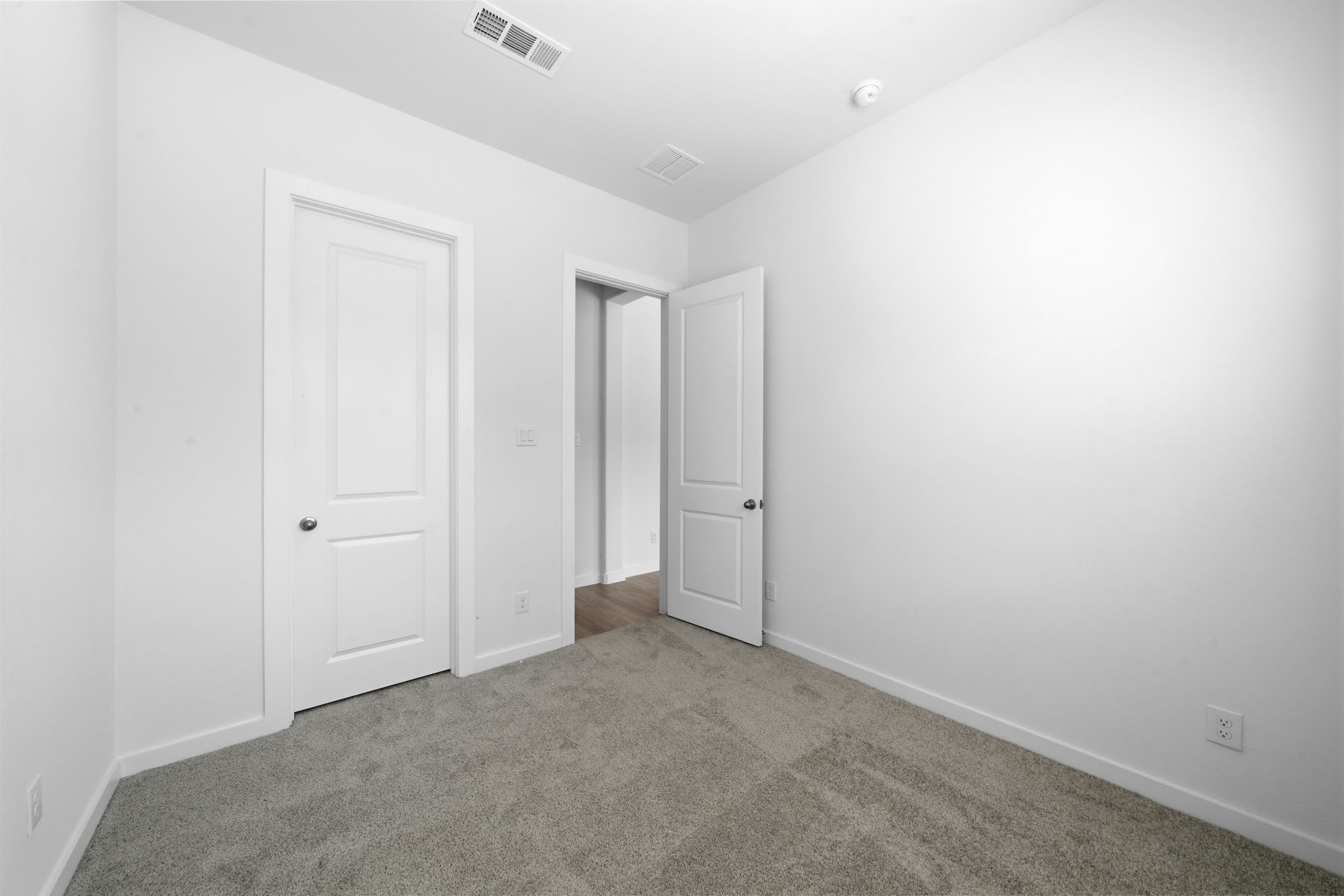 The downstairs guest suite offers a versatile space ready to become whatever fits your lifestyle. Whether you envision a private guest retreat, home office, creative studio, or personal space of your own, this room gives you the freedom to make it truly yours.