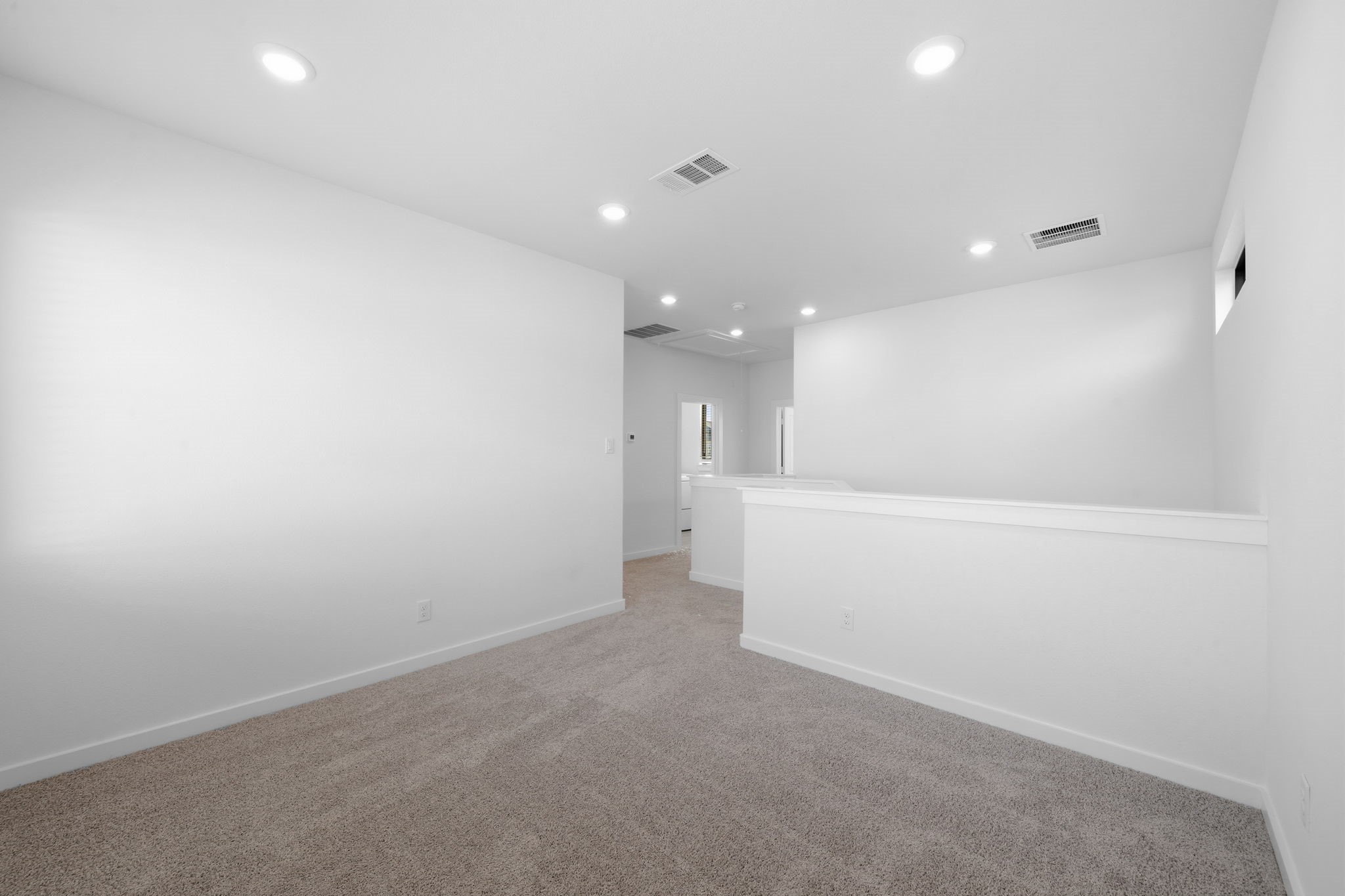 As you make your way upstairs, the versatile loft offers a comfortable second living area perfect for movie nights, a playroom, or a cozy space to gather with family. With its open layout, recessed lighting, and plush carpeting, this space is ready to become your favorite room upstairs.