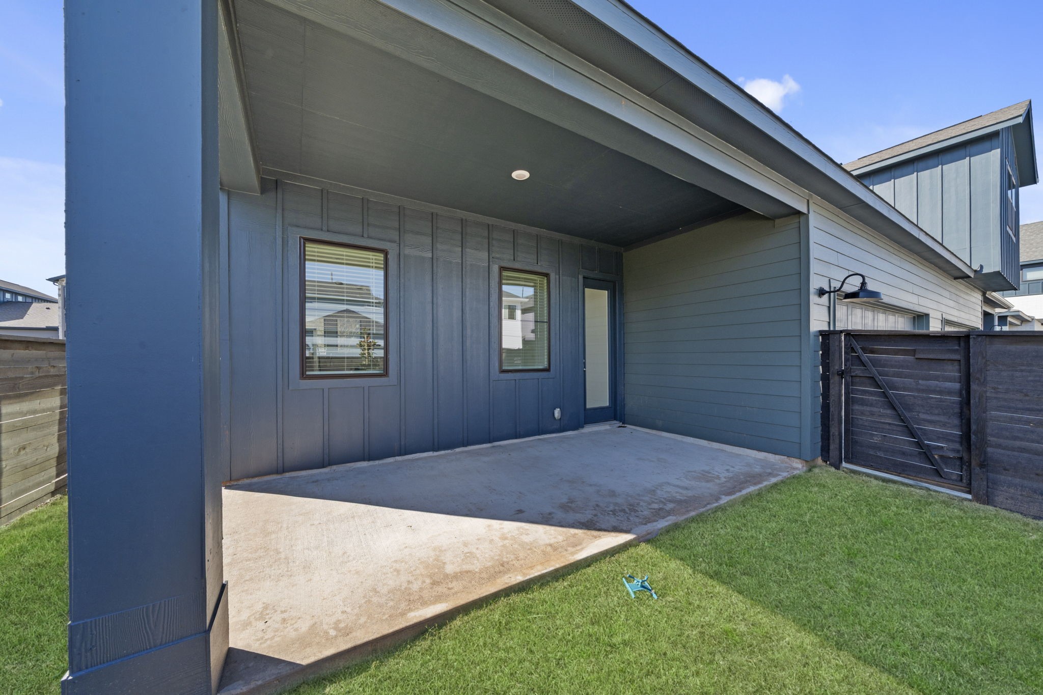 Back on the main floor, step outside to your private, fully fenced backyard and covered patio, ready for morning coffee, weekend gatherings, or simply unwinding outdoors. Convenient gate access leads directly to the driveway and two-car garage, making everyday living feel effortless.