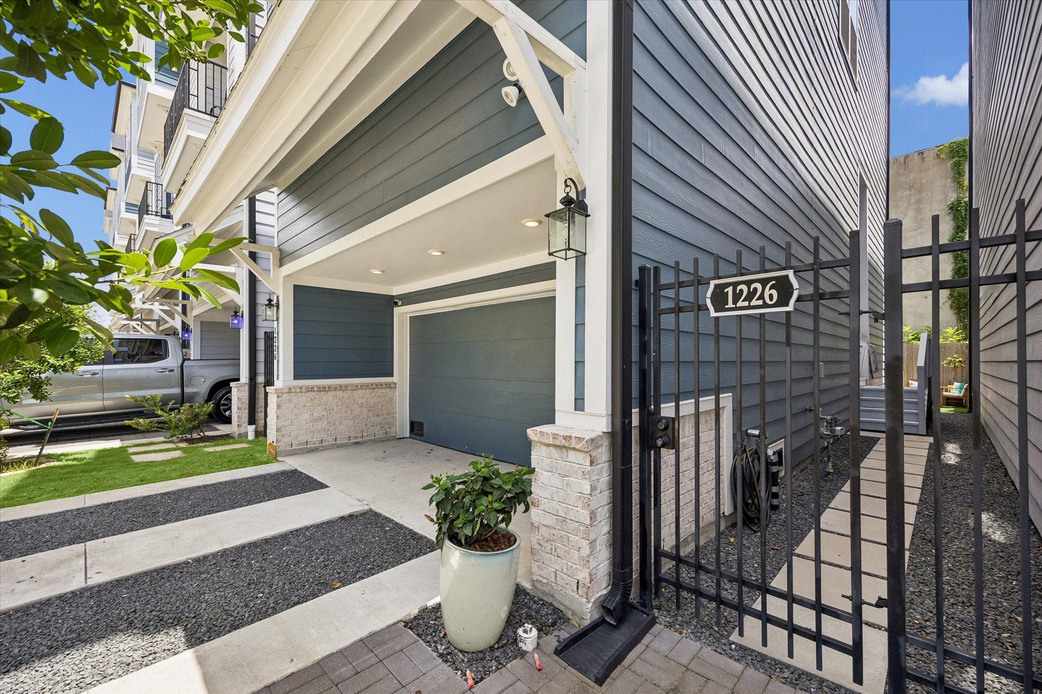 A gated side entry, private driveway, 2-car garage, and modern exterior details give this home a polished arrival that feels both stylish and secure.