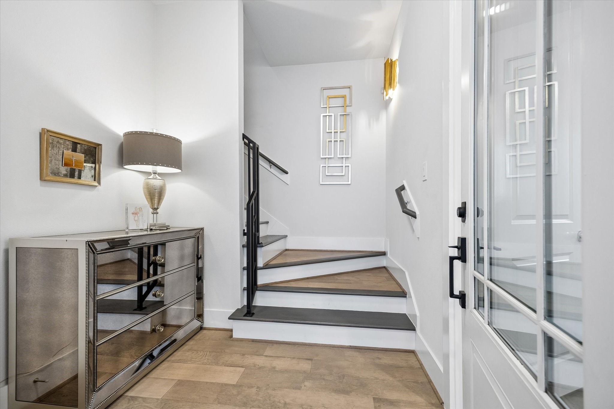 Open this door to comfort and style in a flexible floor plan designed to meet your needs. With open and airy main-floor living, dining, and a stunning island kitchen, plus 3 private suites including one on the first floor and two on the third, this home has the space, design, and location you have been searching for.