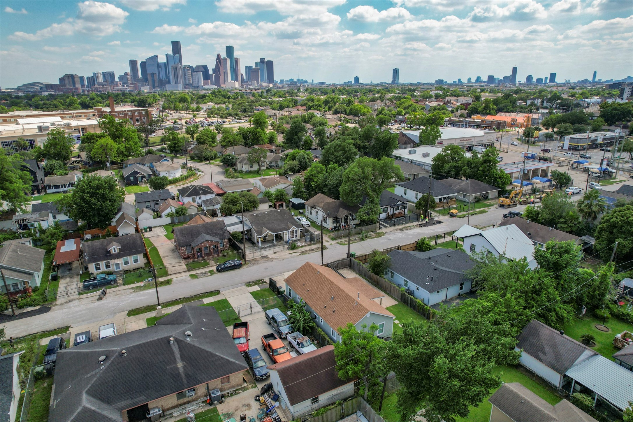 Wide aerial showcasing the Near Northside neighborhood with unobstructed Downtown Houston skyline views, demonstrating the property's prime urban location and strong appreciation corridor.