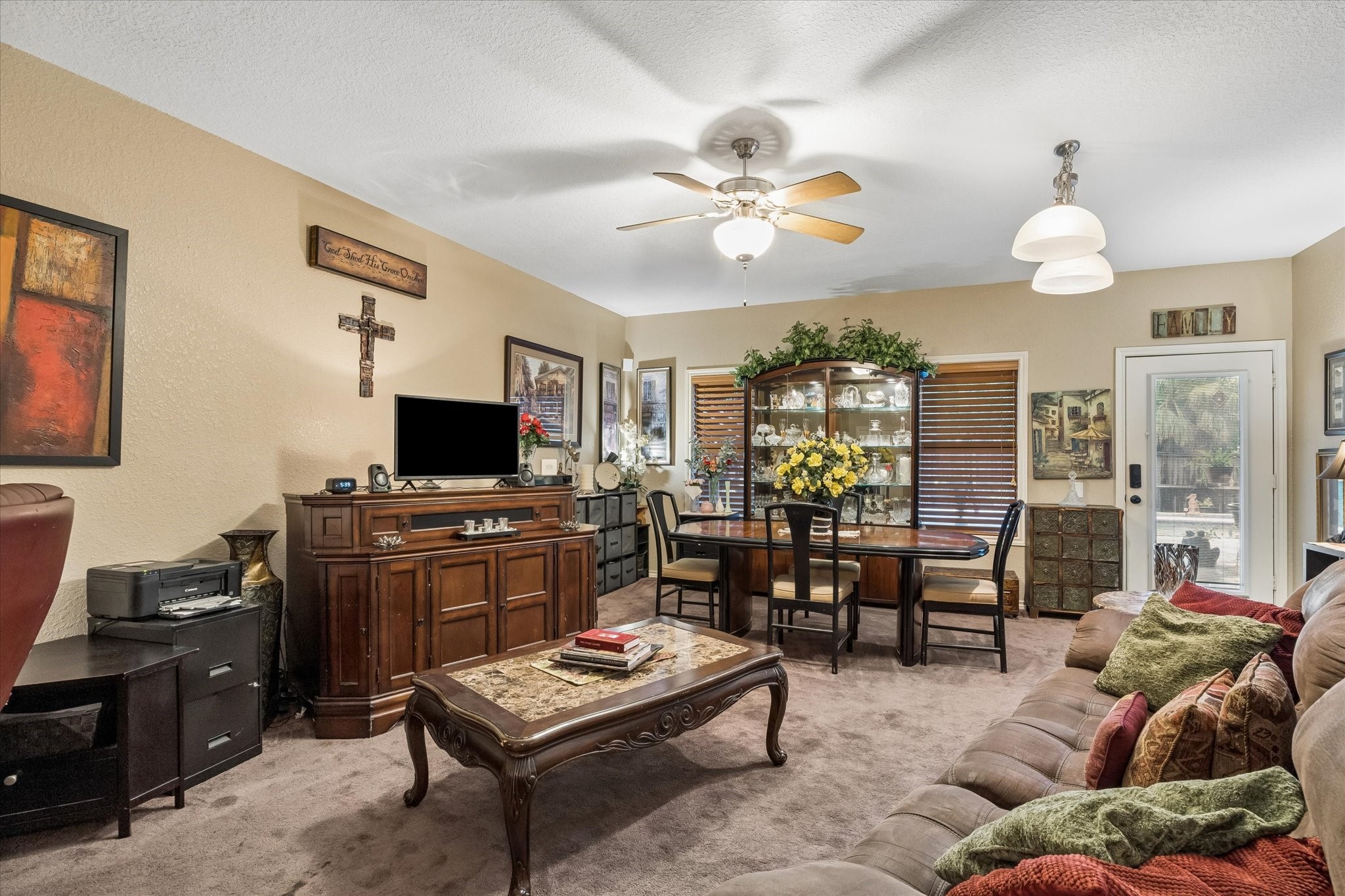 Downstairs living area currently utilized as a separate rental space, offering flexible use as a game room, media room, playroom, or additional living area. Spacious layout supports multiple configurations for extended living or income potential.