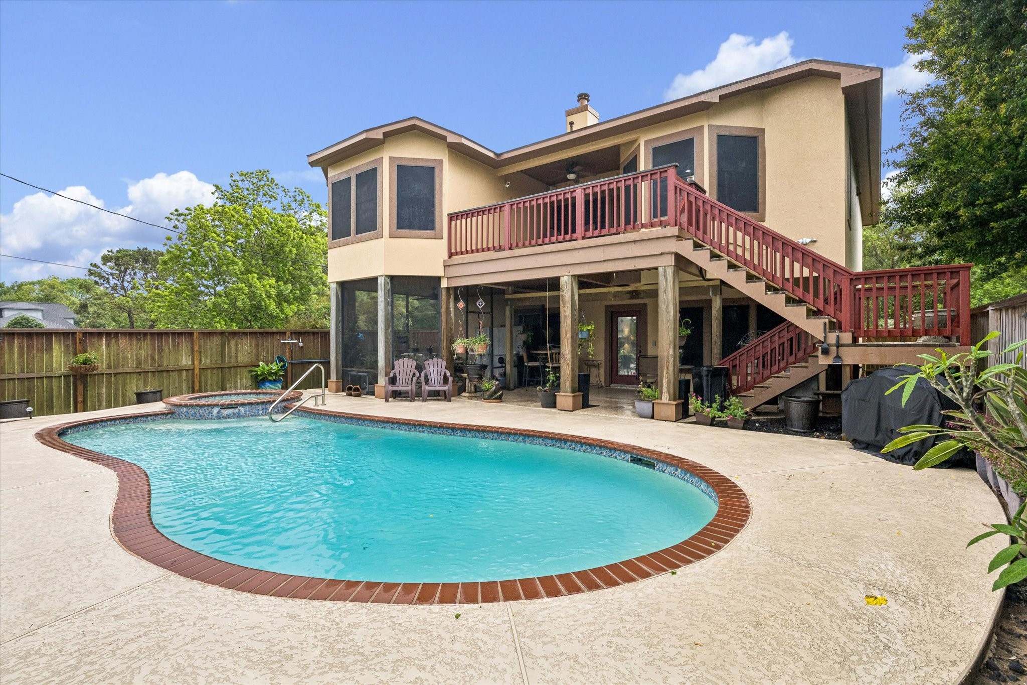 Private backyard with heated pool and spa, surrounded by plenty of patio for outdoor entertaining. Elevated deck with secondary stair access to the upstairs, overlooks the pool with covered seating area below adding shade and flaxibility. Private backyard with heated pool and spa, surrounded by plenty of patio for outdoor entertaining. Elevated deck with secondary stair access to the upstairs, overlooks the pool with covered seating area below adding shade and flaxibility.