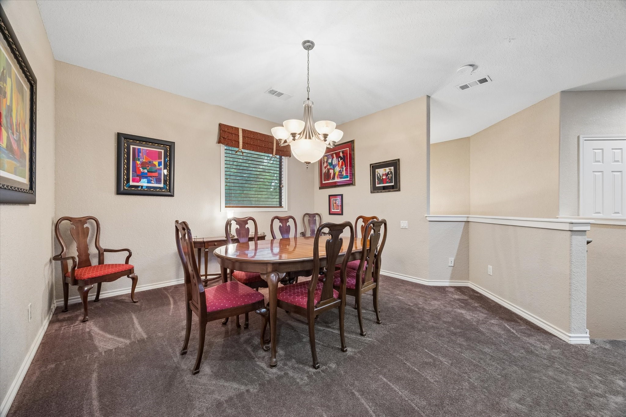 Dedicated dining area with overhead lighting, offering ample space for a full-size table and seating. Open to the main living area, ideal for both everyday dining and entertaining.