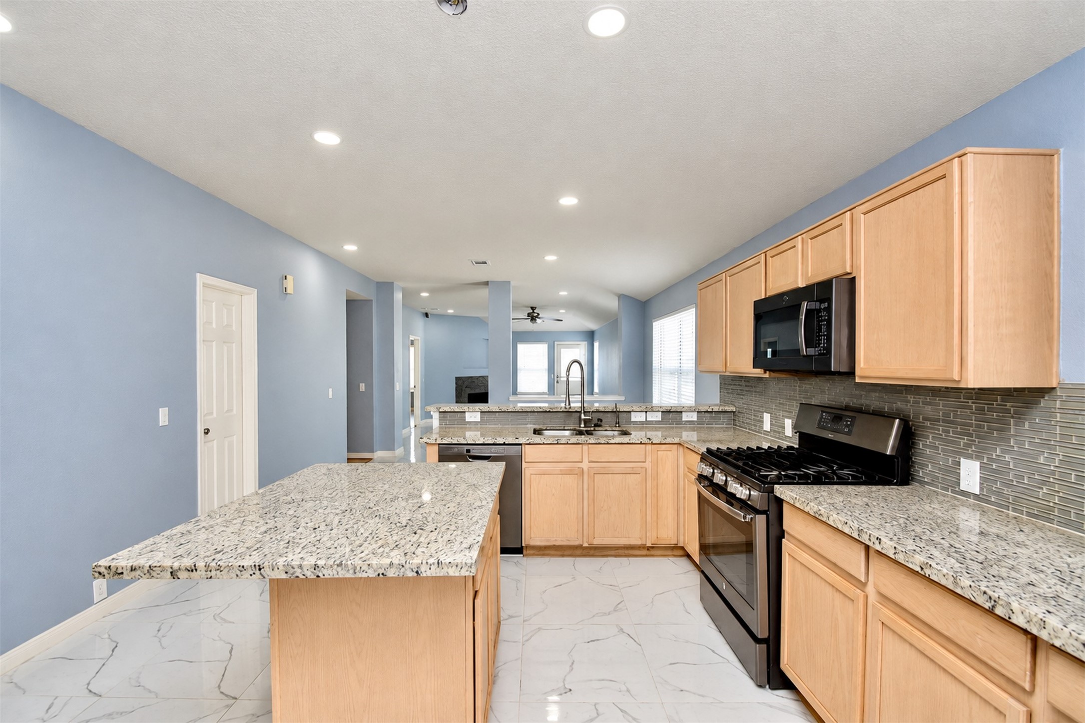 Kitchen Area
***Property is vacant. Photo digitally enhanced with AI; lighting, color, and ceiling appearance adjusted. ***