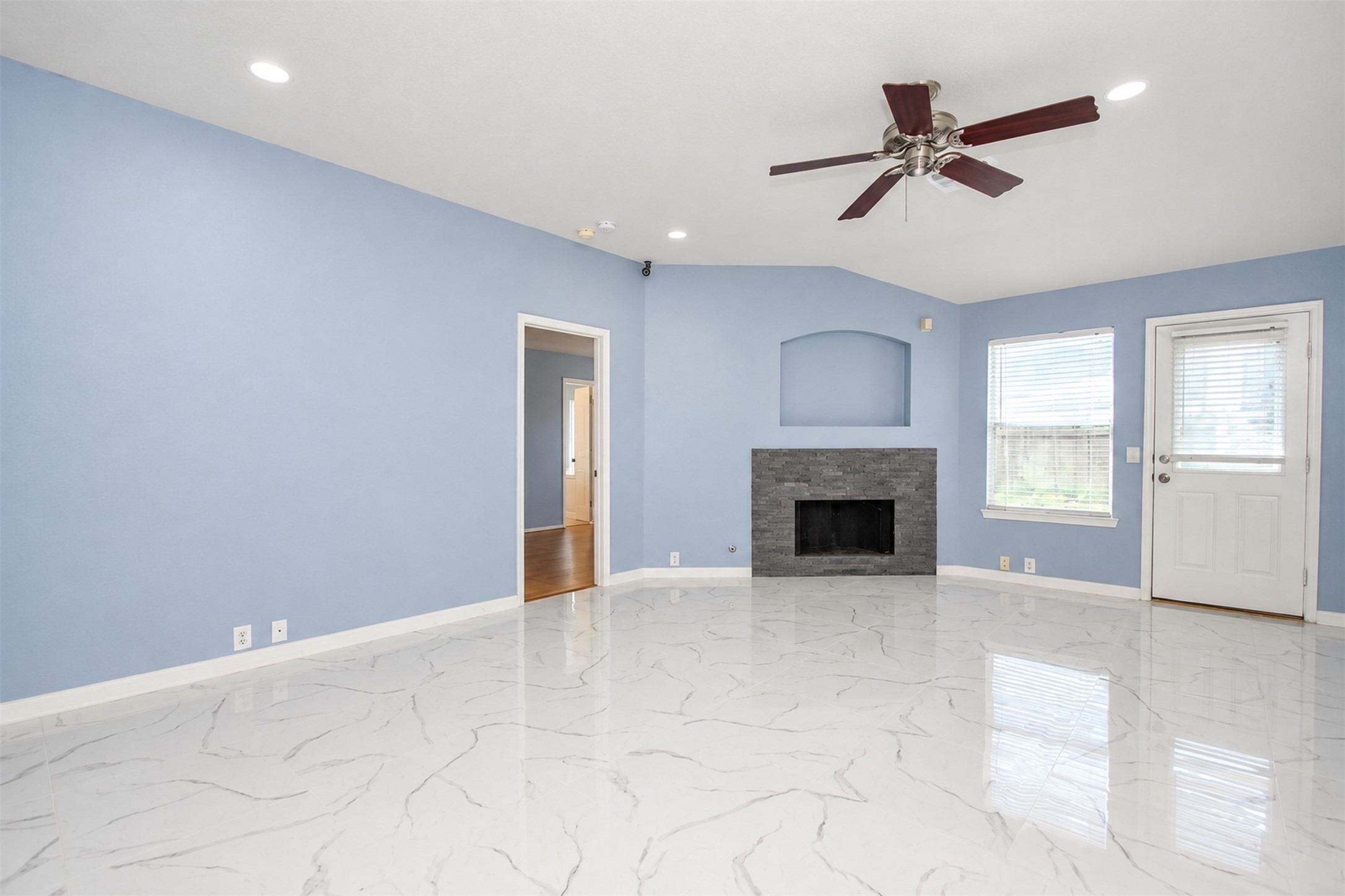 Living Area
***Property is vacant. Photo digitally enhanced with AI; lighting, color, and ceiling appearance adjusted. ***