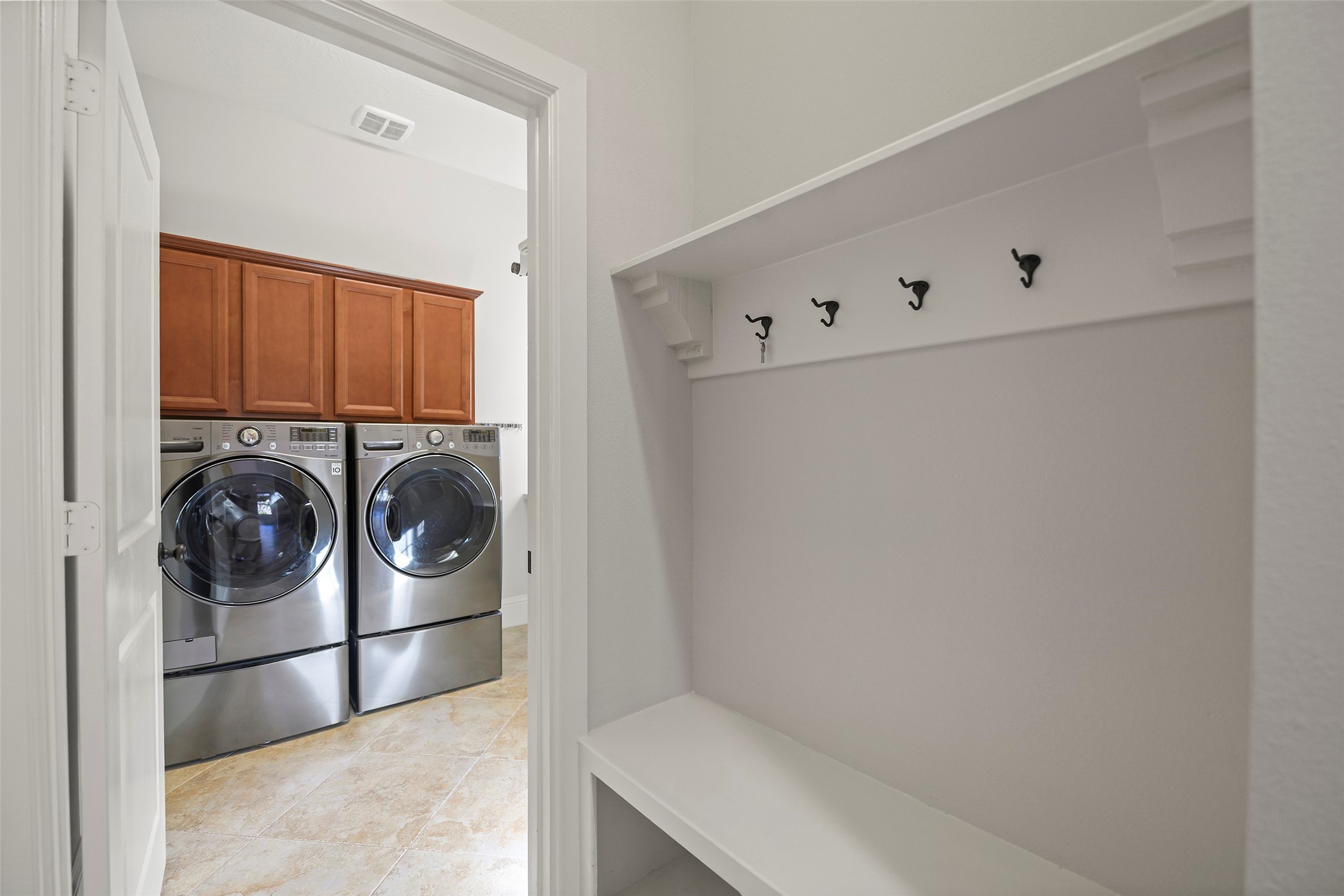 Amazing laundry room with access to the mudroom.  Washer and Dryer included.