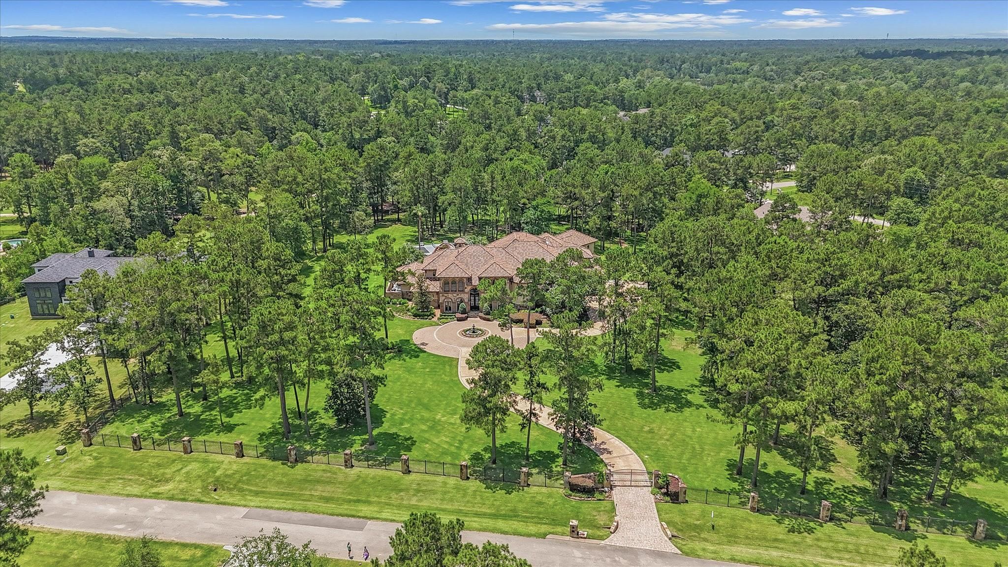 Fully Gated 4.16 Acres with full Exterior Surveillance Cameras system. Custom stain concrete Driveway with stone pavers. Newly reconstructed concrete fountain.
