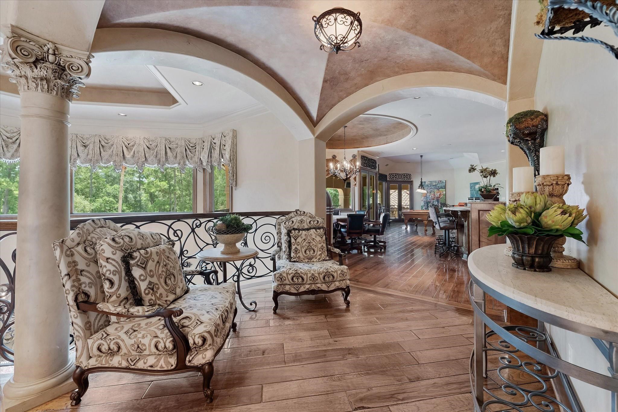 Venetian plaster dome ceiling with custom chandeliers with Custom Tray Ceiling With Cove Lighting, Recessed Speakers, and Recessed Lighting.