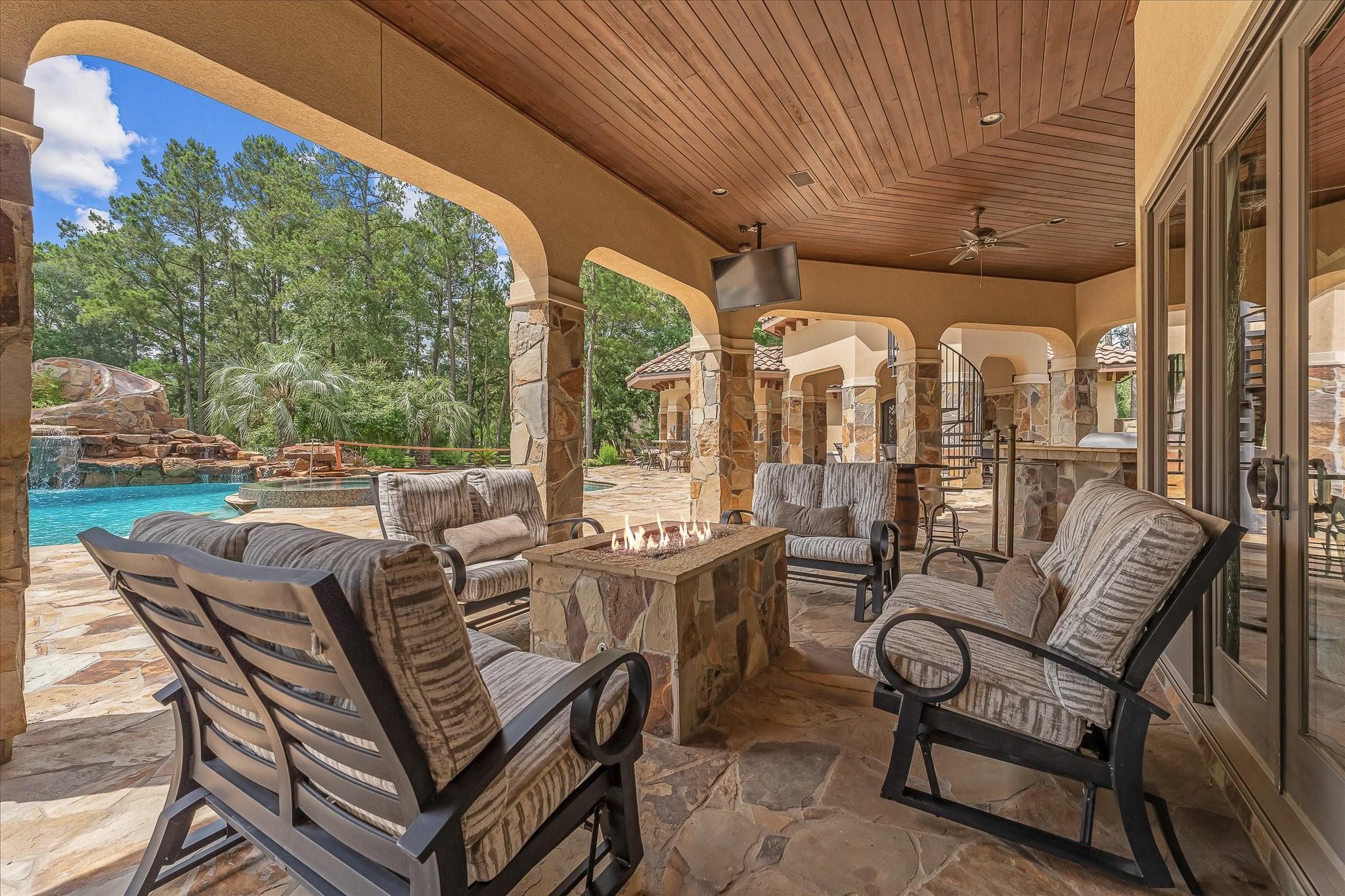 Summer Kitchen With Granite Countertop, Gas Grill With Side Burner, Sink, and outdoor fridge. Access
to a full outdoor dauh.