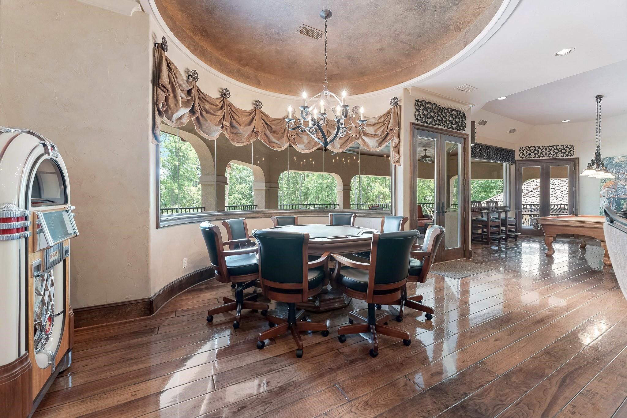Large Bay windows, frameless round bay windows provide southern exposure. Two dual exterior framed window doors lead out to a spacious private balcony area with views of the entire backyard and a spiral staircase for easy access to the backyard amenities.