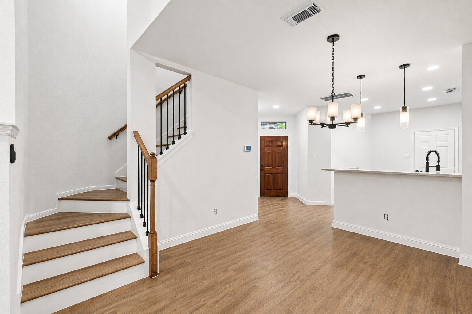 Open first-floor layout with easy flow between the living area, dining space and kitchen.