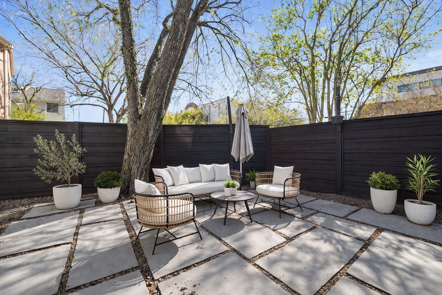 Discover a serene, private back patio ideal for both relaxing and entertaining, offering the perfect retreat for any occasion.