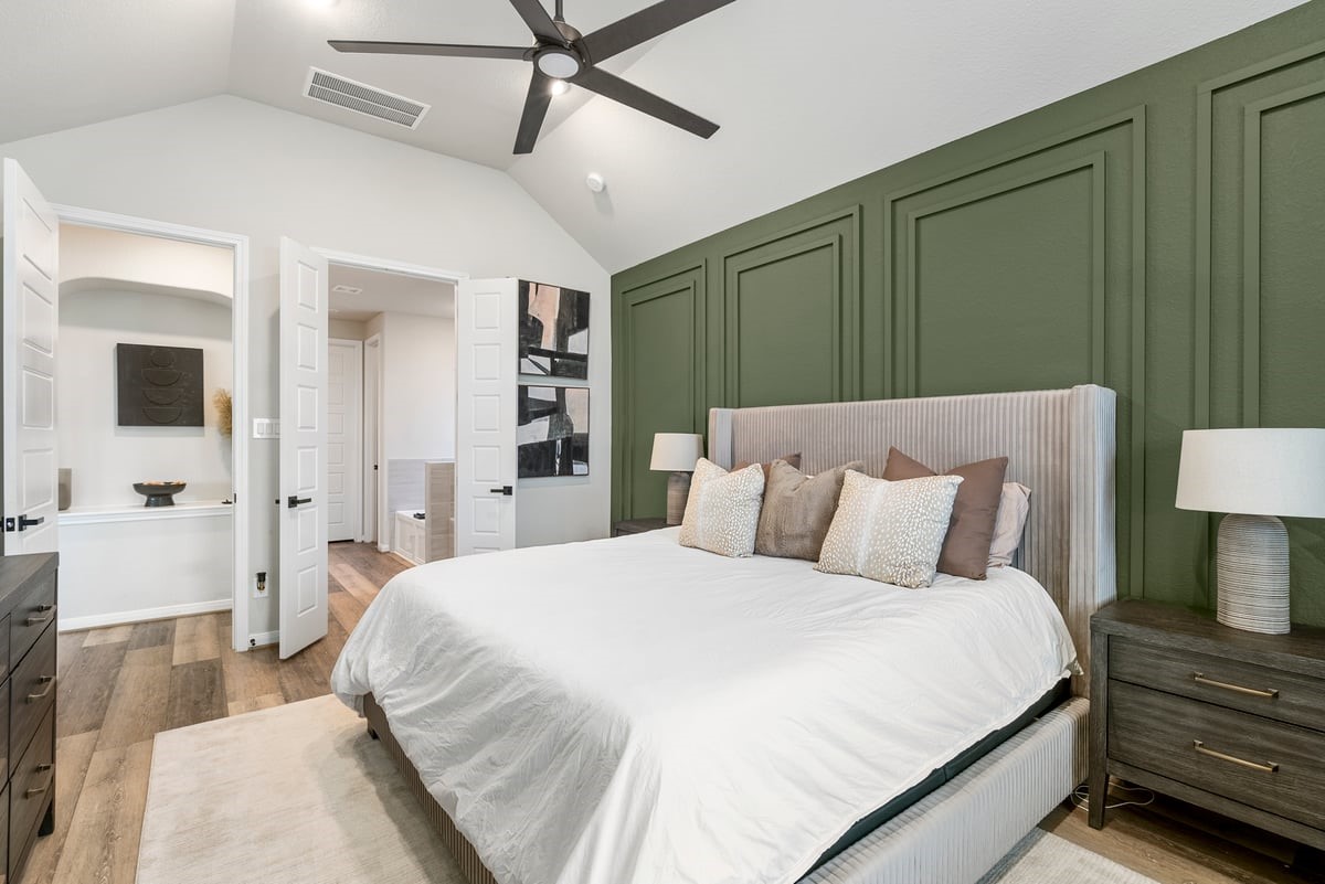 Upgrades include a custom accent wall, and modernized ceiling fan! Vaulted ceilings create the perfect environment for relaxation!