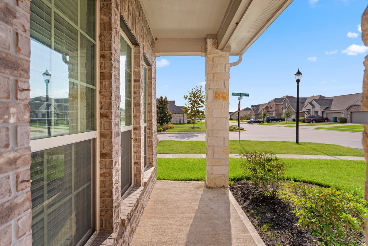 The covered front porch is a perfect place to enjoy an afternoon and wave hi to neighbors passing by!