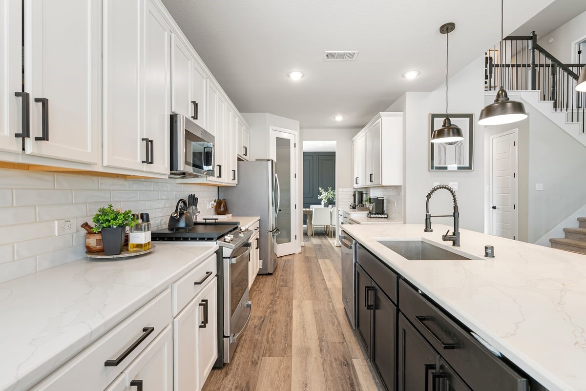 Prep gourmet meals on the expansive quartz counters with subway tile backsplash!