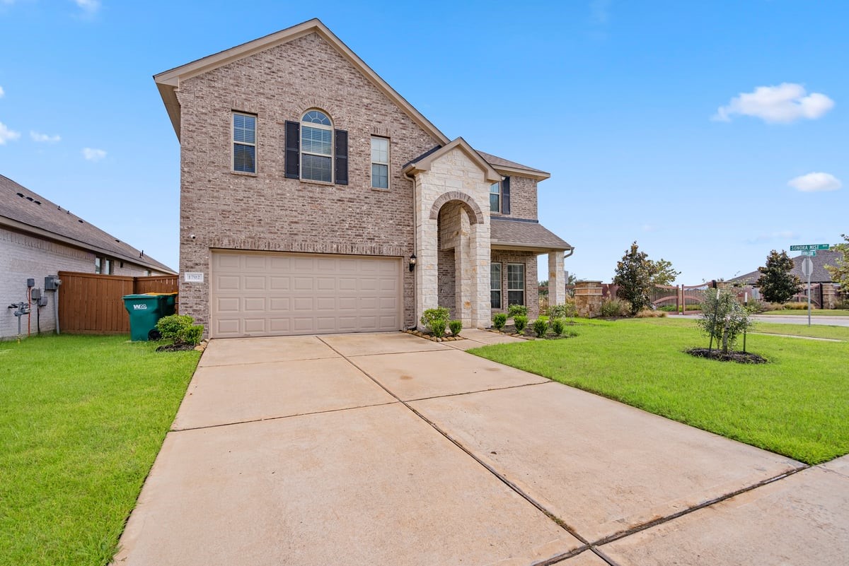 Double wide driveway leads to a private garage, giving you plenty of space for parking and storage!